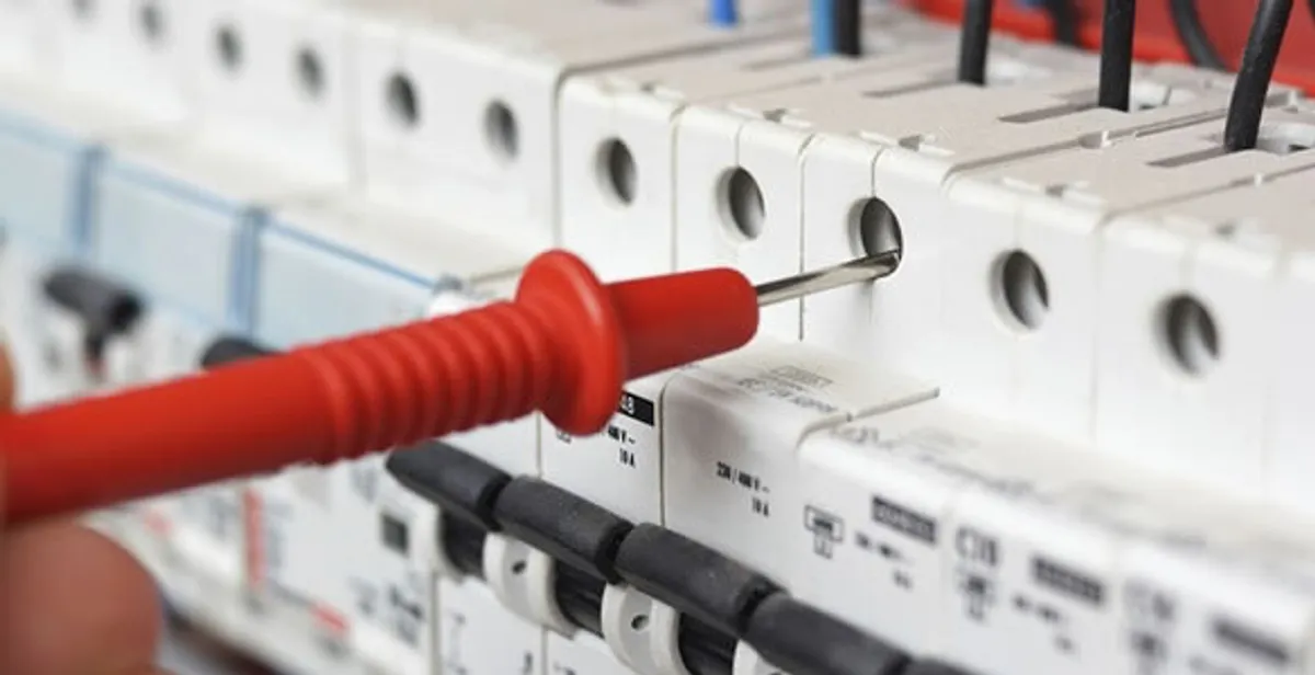 Electrical contractor testing circuit breakers during electrical repair in Brusly, LA