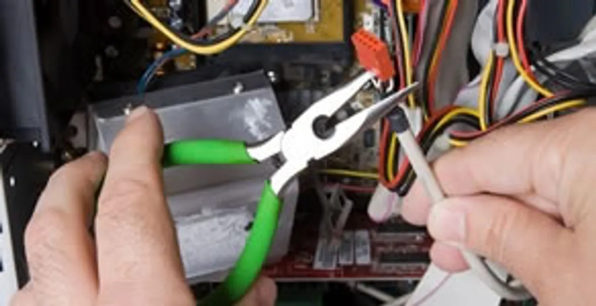 Licensed electrical contractor performing electrical repair with tools in Sunshine, LA