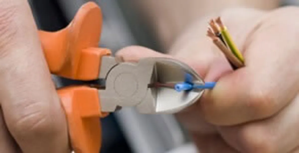 professional electrical services showing precise wire cutting by licensed electricians in Baton Rouge, LA