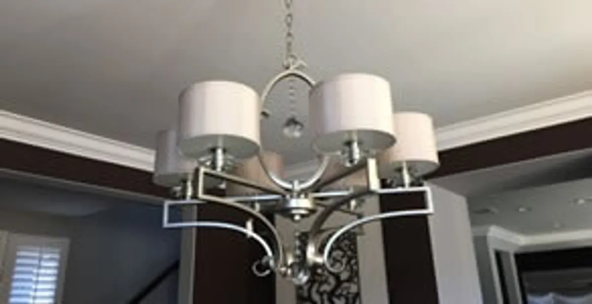 Modern chandelier installation with multiple light fixtures in Baton Rouge, LA